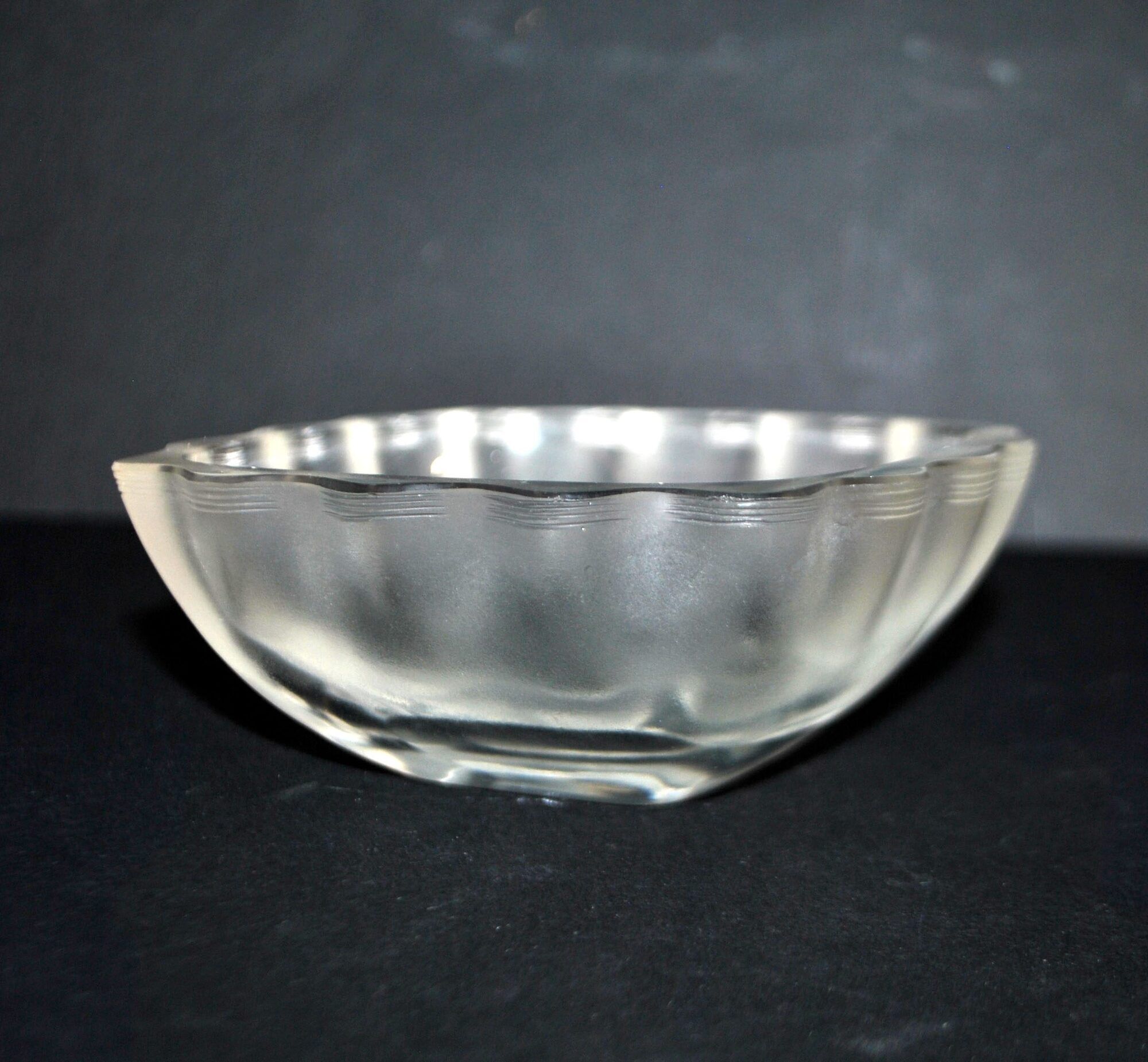 Lalique glass ashtray bowl with frosted finish, engraved with wave design, signed Lalique.