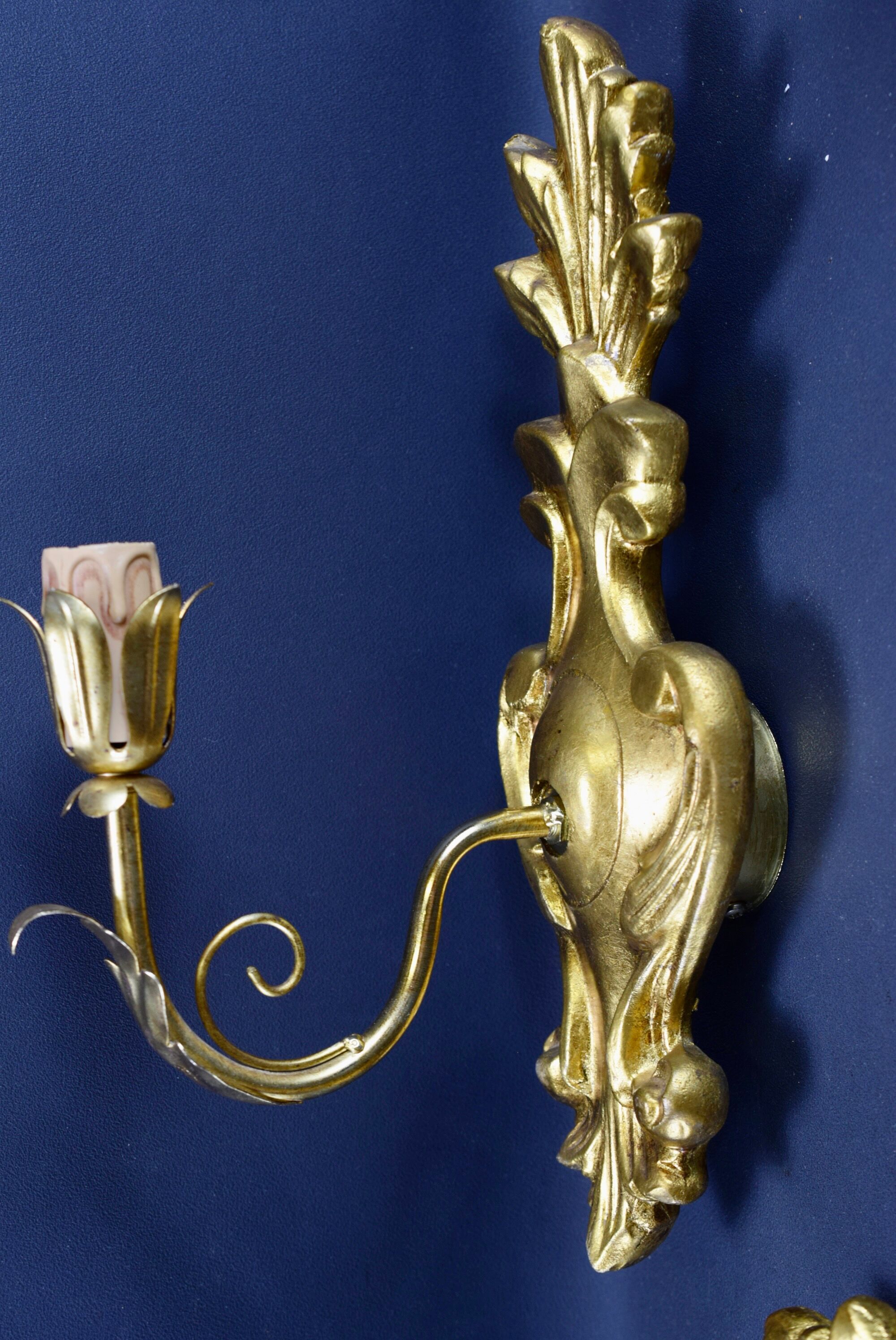 Pair of walled carved wood wall lamps