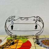 Metal doll's bed on vintage casters