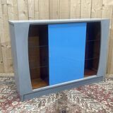 Showcase with sliding doors in painted wood