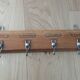 Tea towel holder, wooden and metal towel hook.