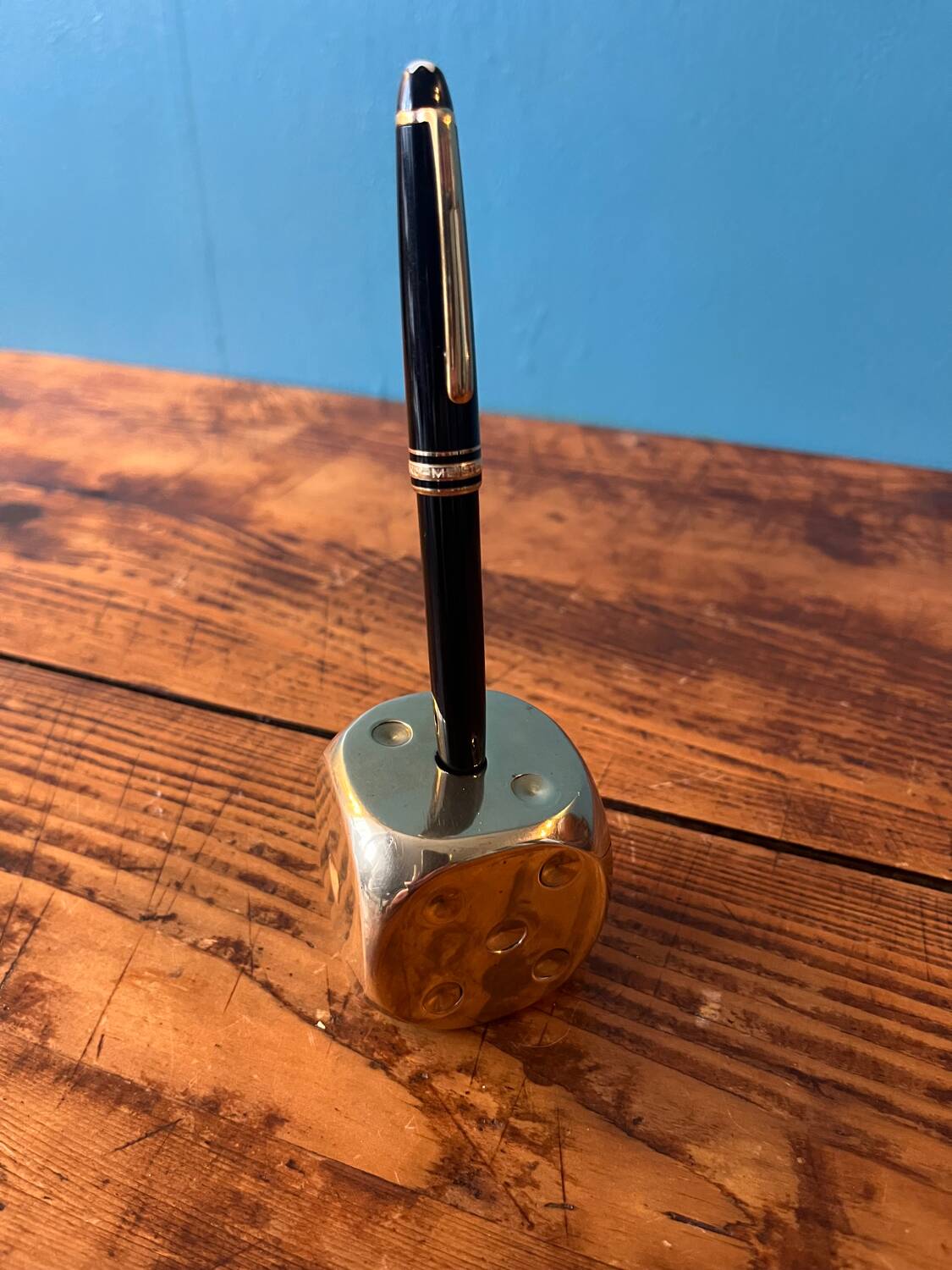 Pen holder, die-shaped brass paperweight