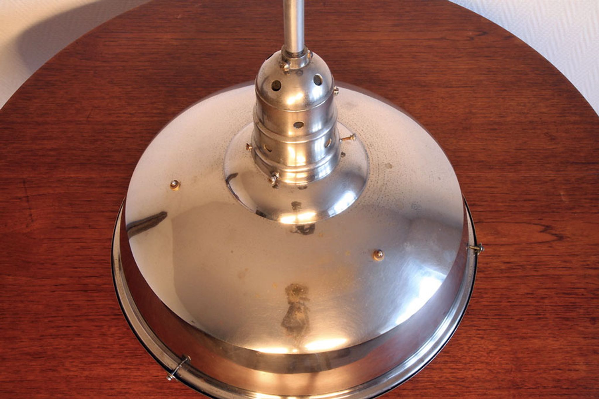 Old Bauhaus lamp in mercurized glass chrome industrial suspension.