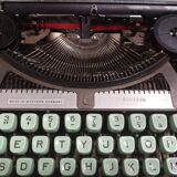 Hermès Baby lime green typewriter with suitcase