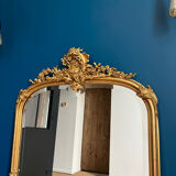 Antique mirror with pediments 141cm/80cm gilded with gold leaf, beveled ice