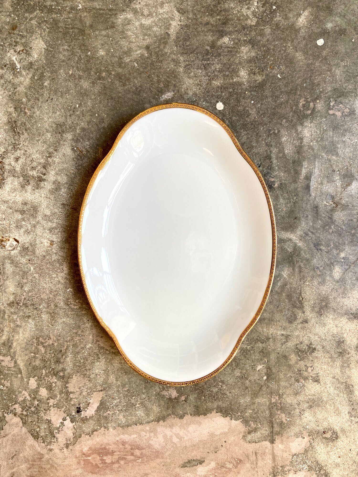 Oval dish in white and golden Limoges porcelain