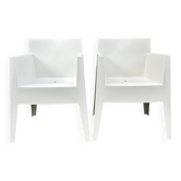 2 white Toy chairs designed by Starck