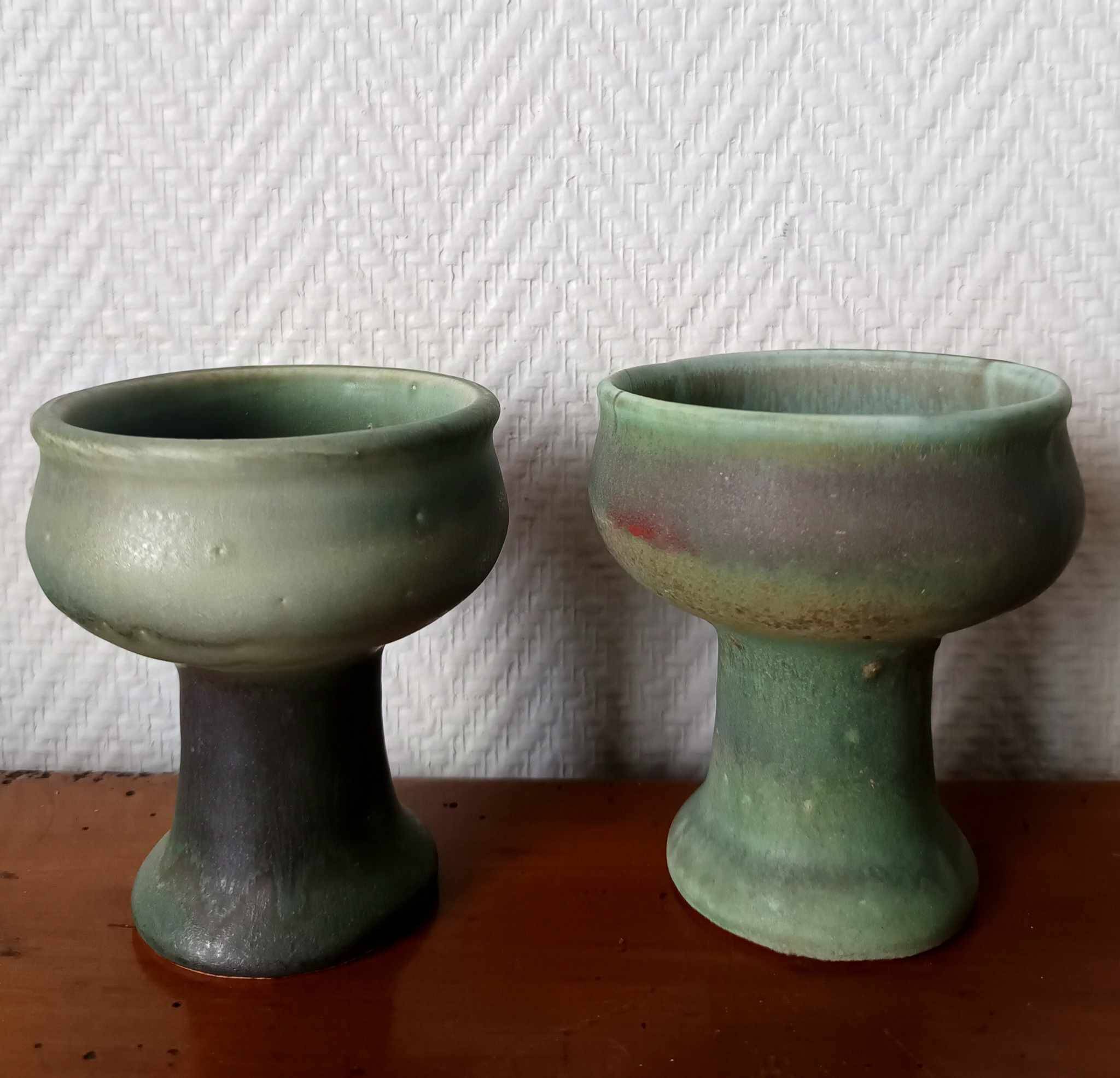 Pair of Belgian ceramic candlesticks on feet
