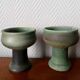 Pair of Belgian ceramic candlesticks on feet