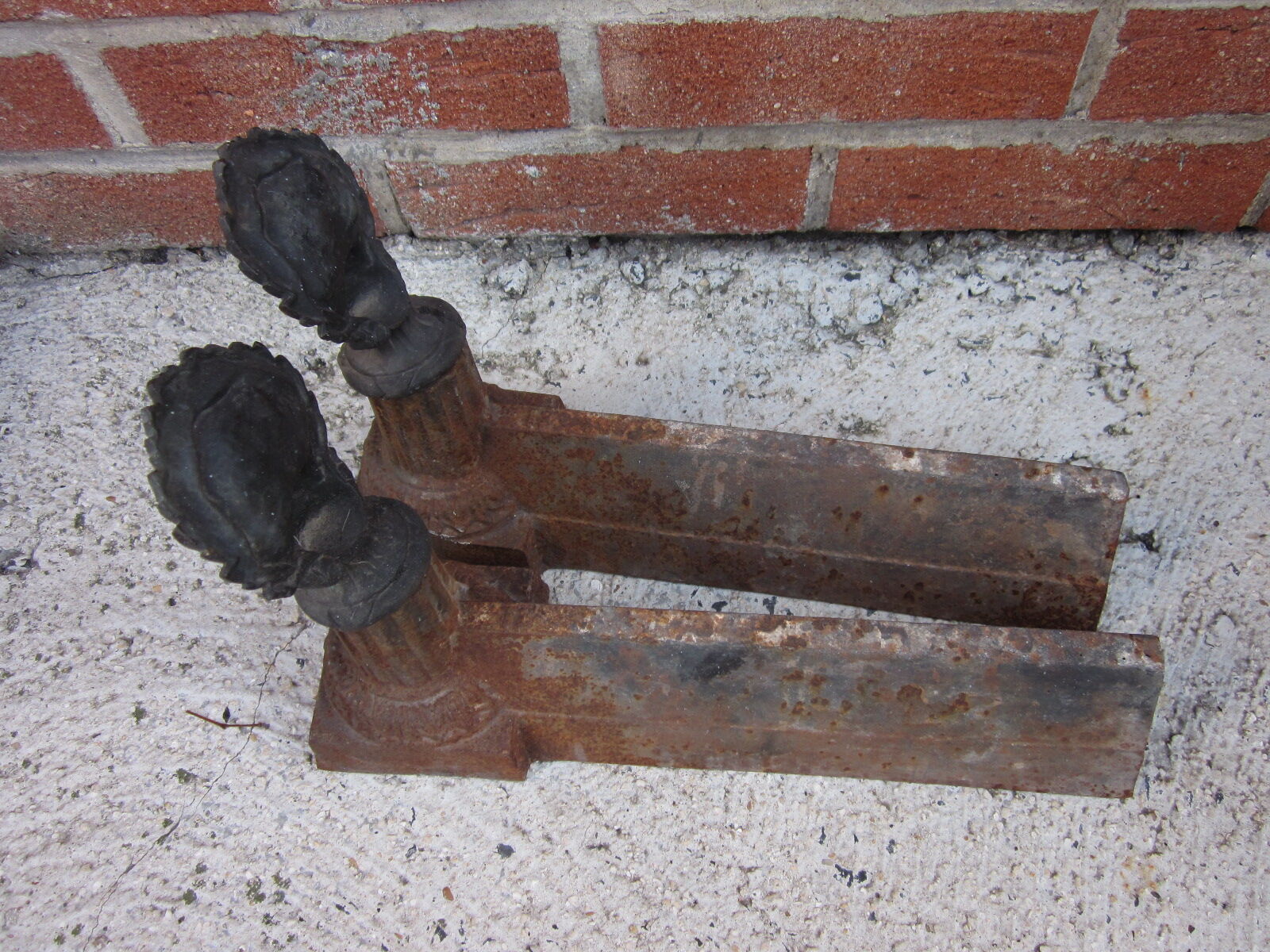 Pair of old cast-iron and bronze chenet