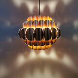 Copper colored hanging lamp. designed by thorsten orrling sweden