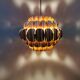 Copper colored hanging lamp. designed by thorsten orrling sweden
