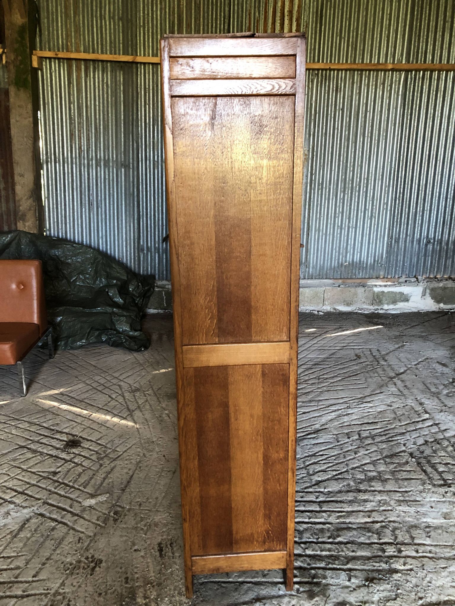 Vintage oak bookcase from the reconstruction period with 2 doors with small panes.