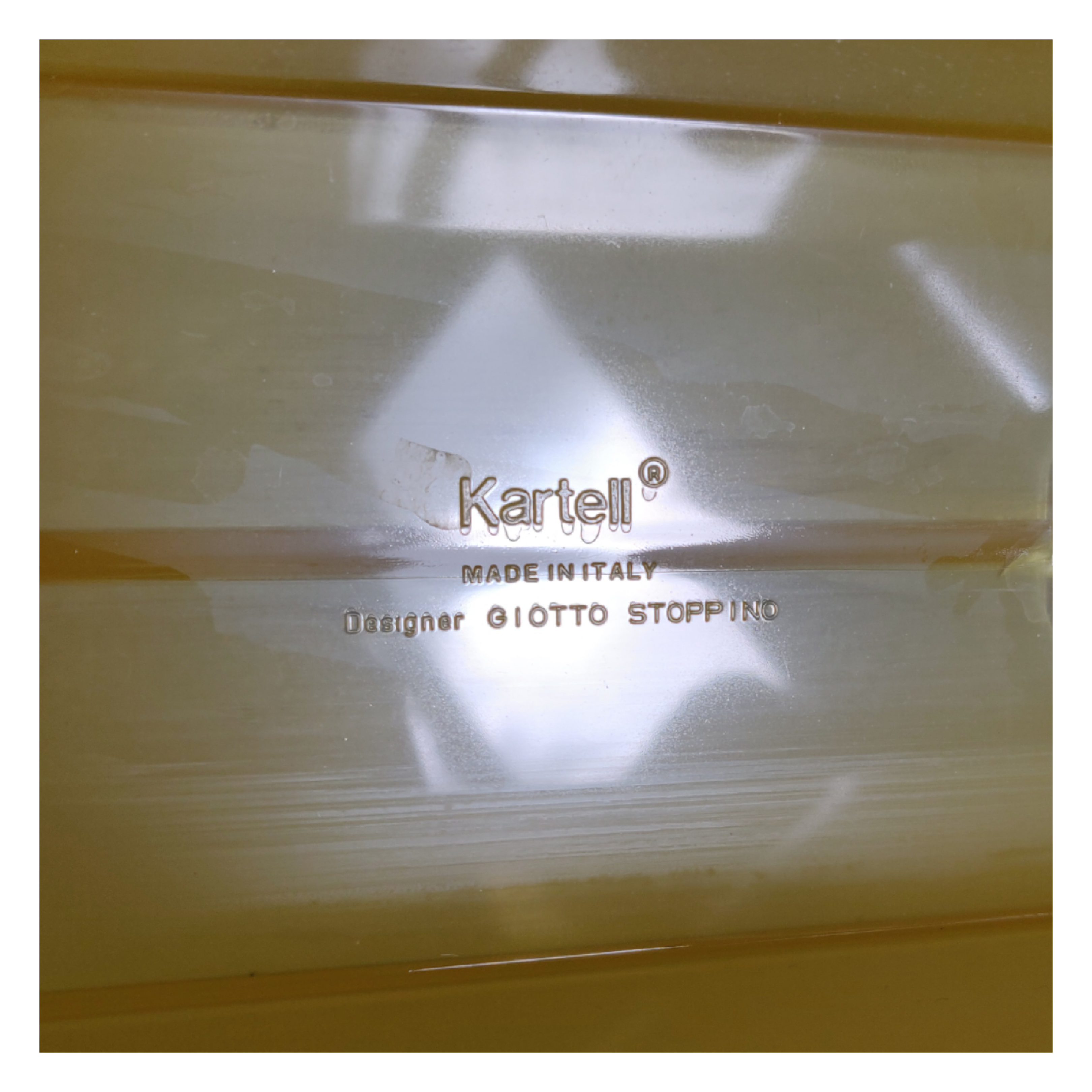 Kartell magazine holder by Giotto Stoppino