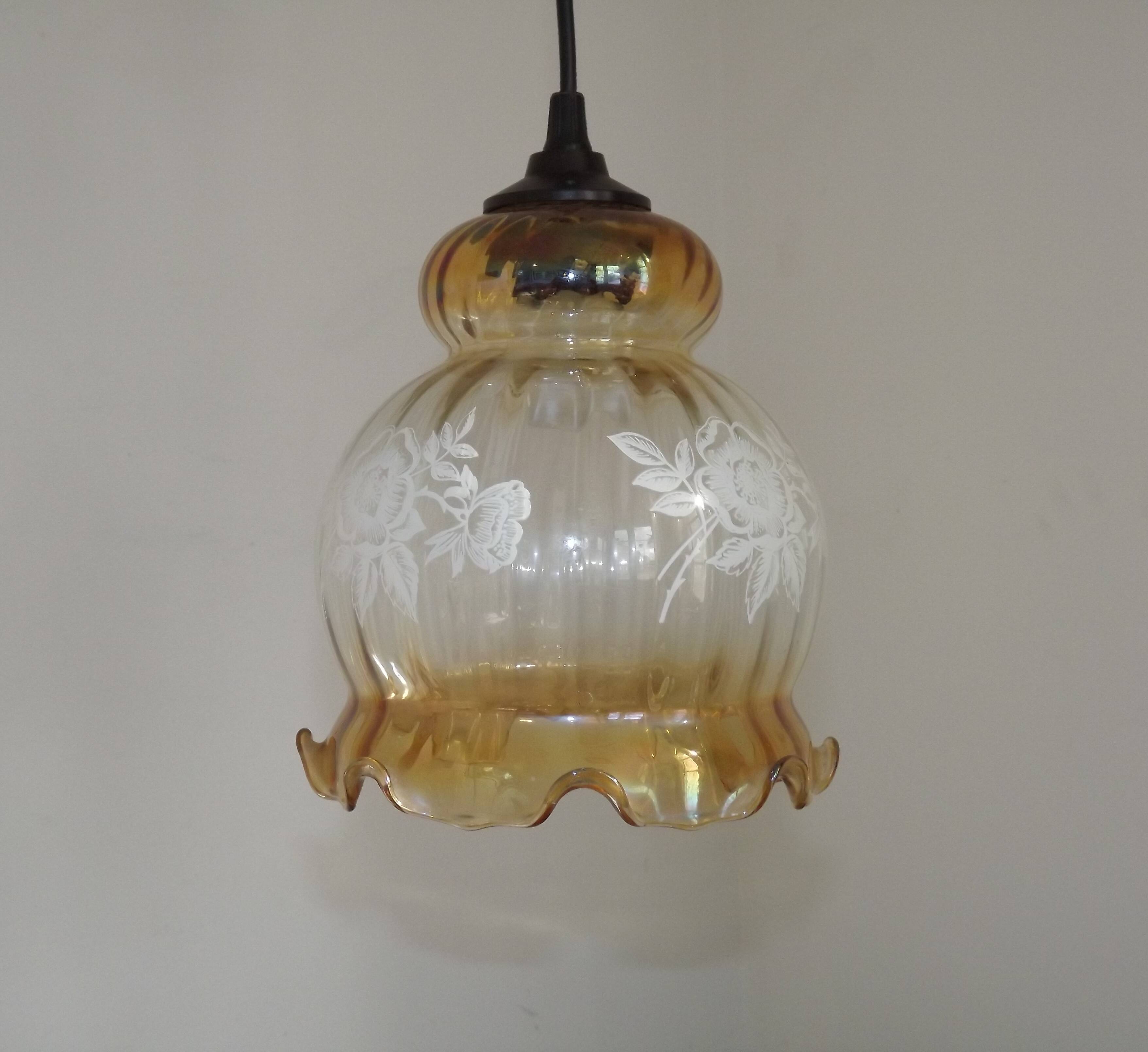 French vintage amber and clear glass ceiling light with white floral decoration.