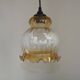 French vintage amber and clear glass ceiling light with white floral decoration.