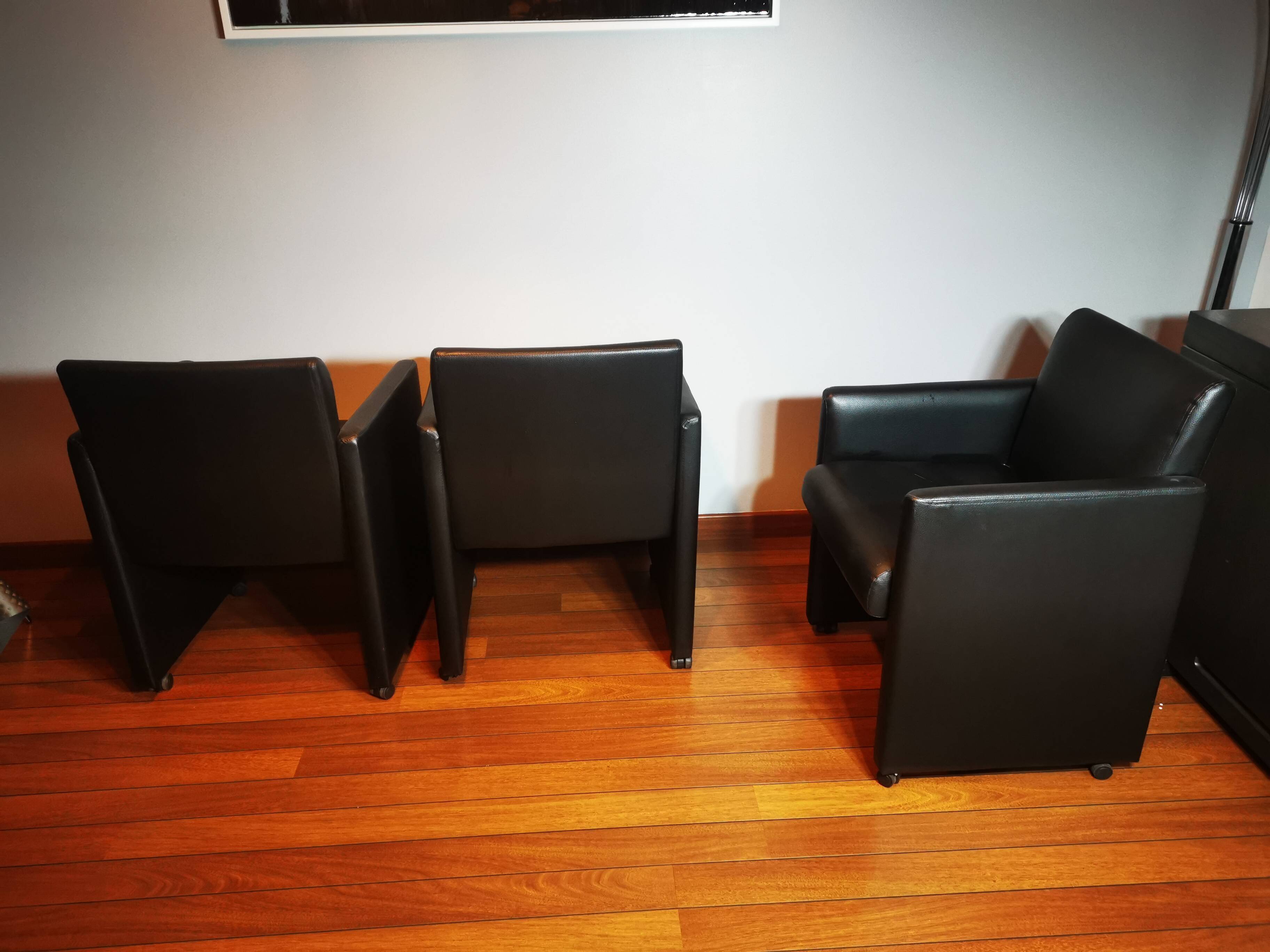 6 faux leather chairs on wheels