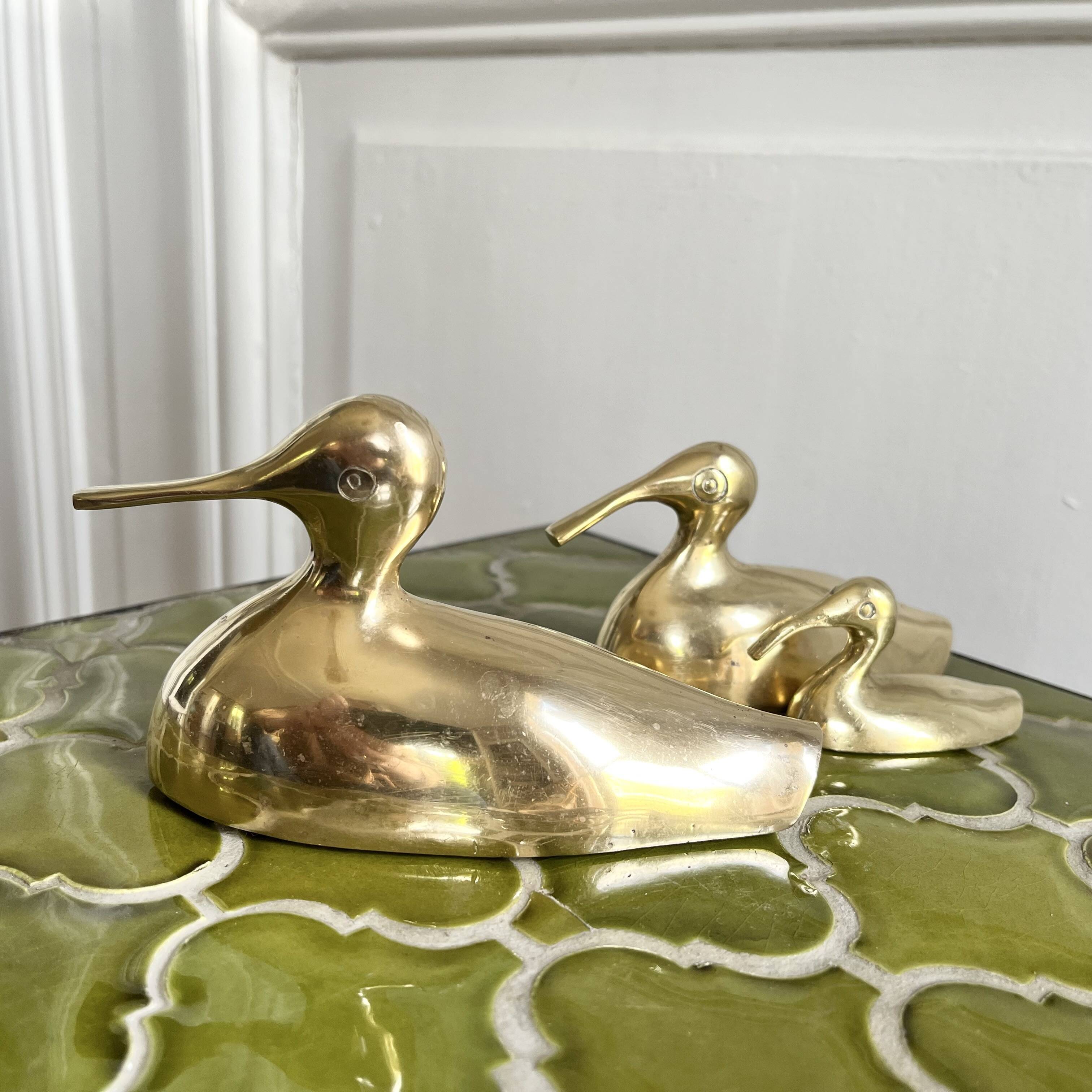 Three brass ducks from the 1950s