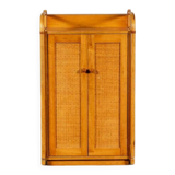 Small storage unit in cane and wood.