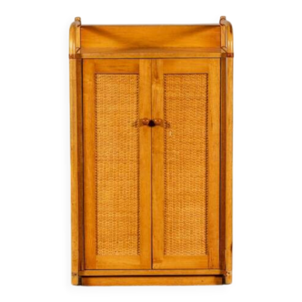 Small storage unit in cane and wood.