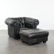 Set of a black cowhide leather Chesterfield armchair and matching ottoman