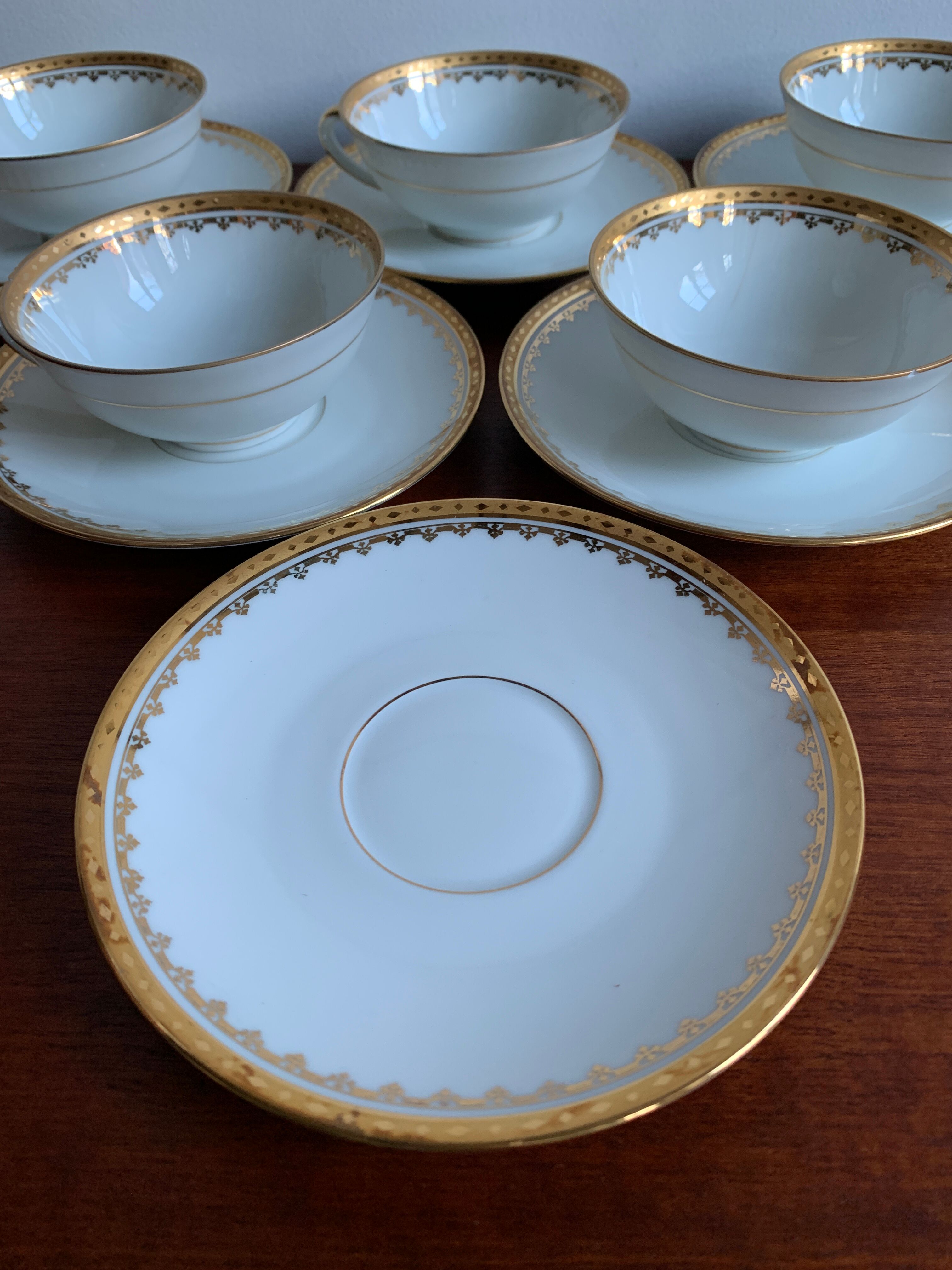 6 cups and golden porcelain saucers