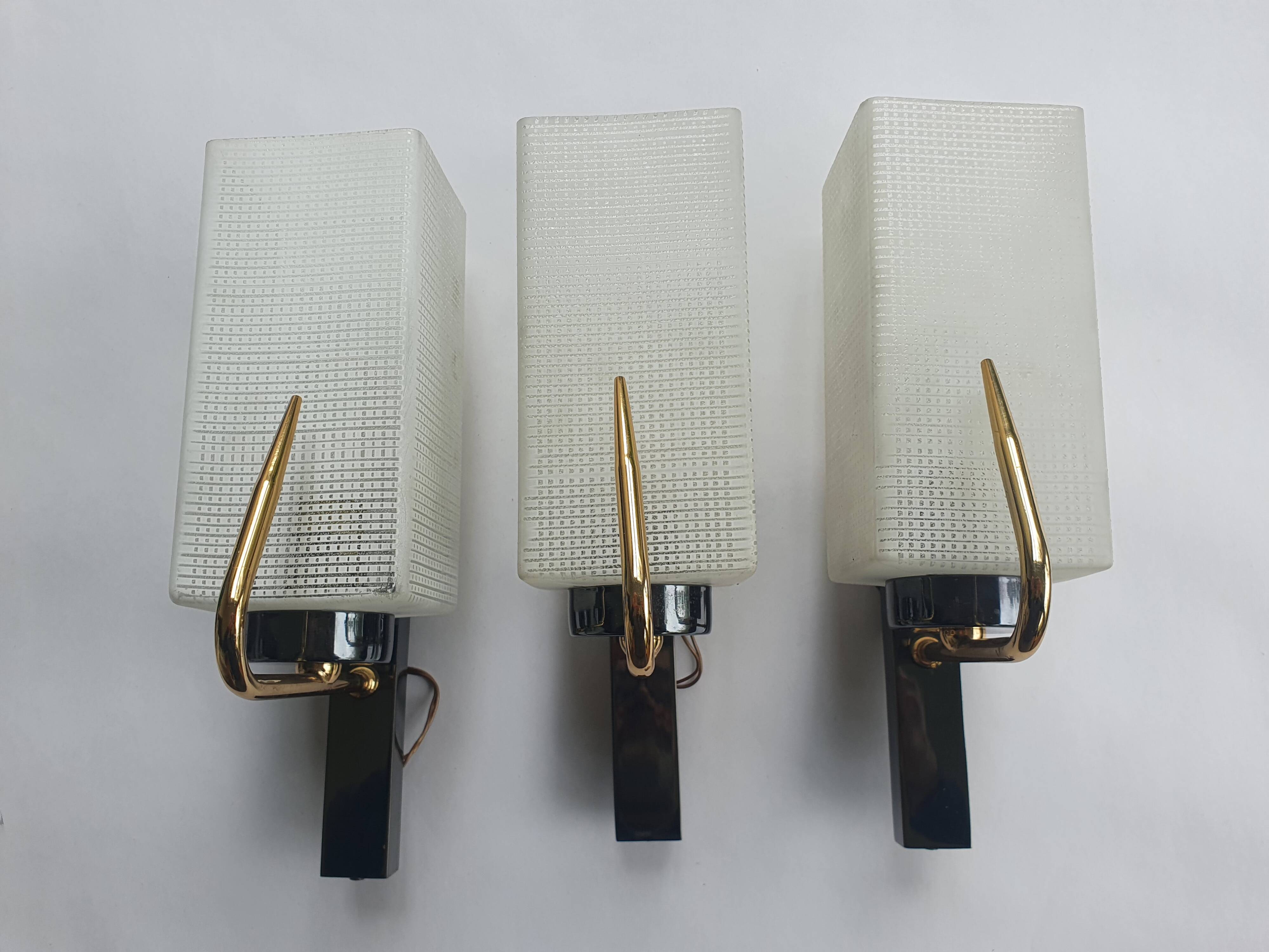 Three antique gold Arlus wall lights from the 50s