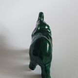 Small emerald green ceramic elephant.