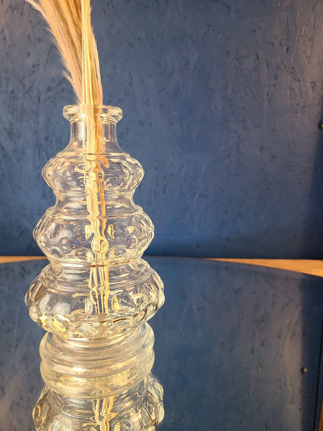 Old 3-branched stone candlestick cut with fine engravings