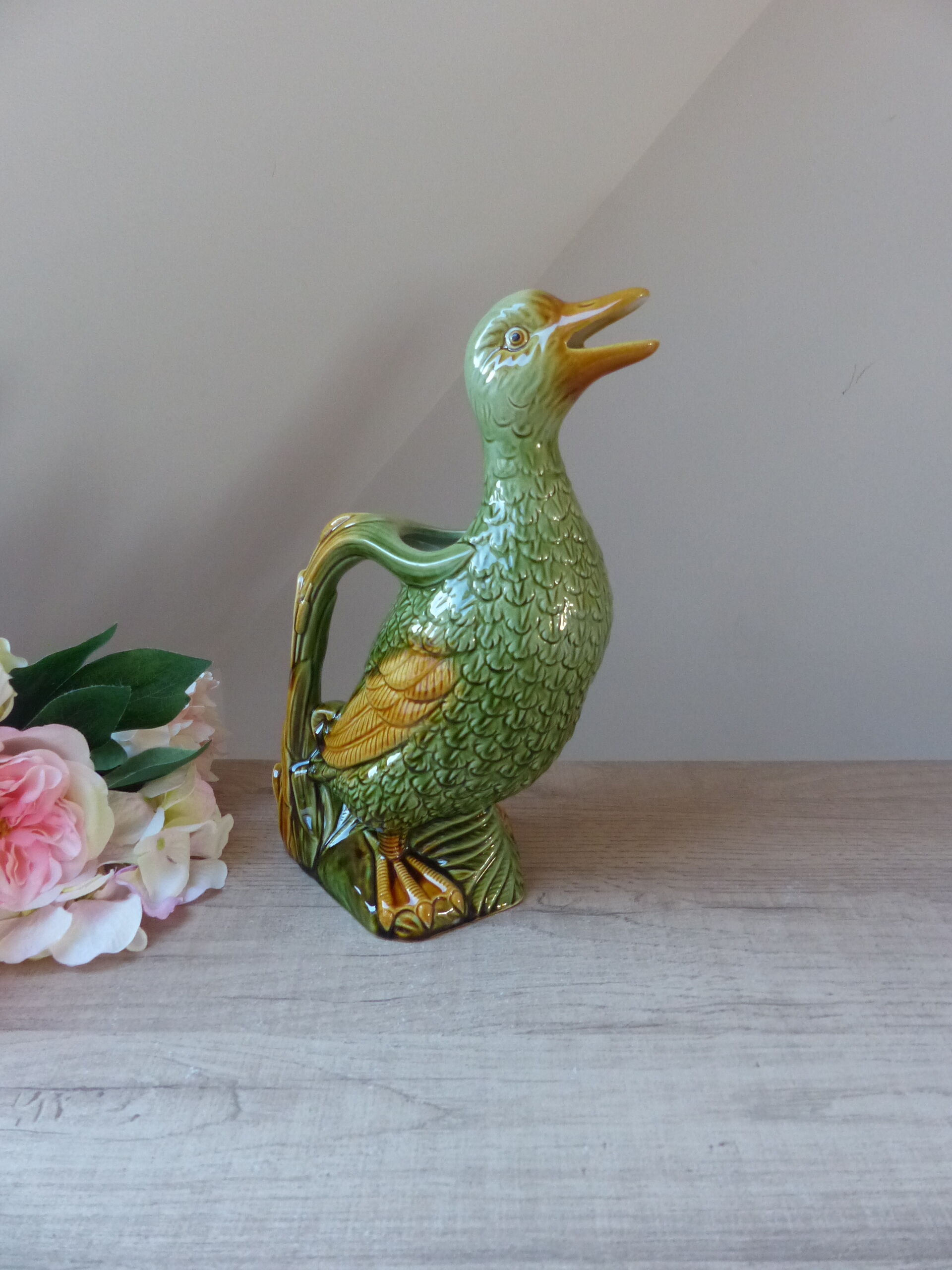 Pitcher zoomorph duck in green and yellow slip