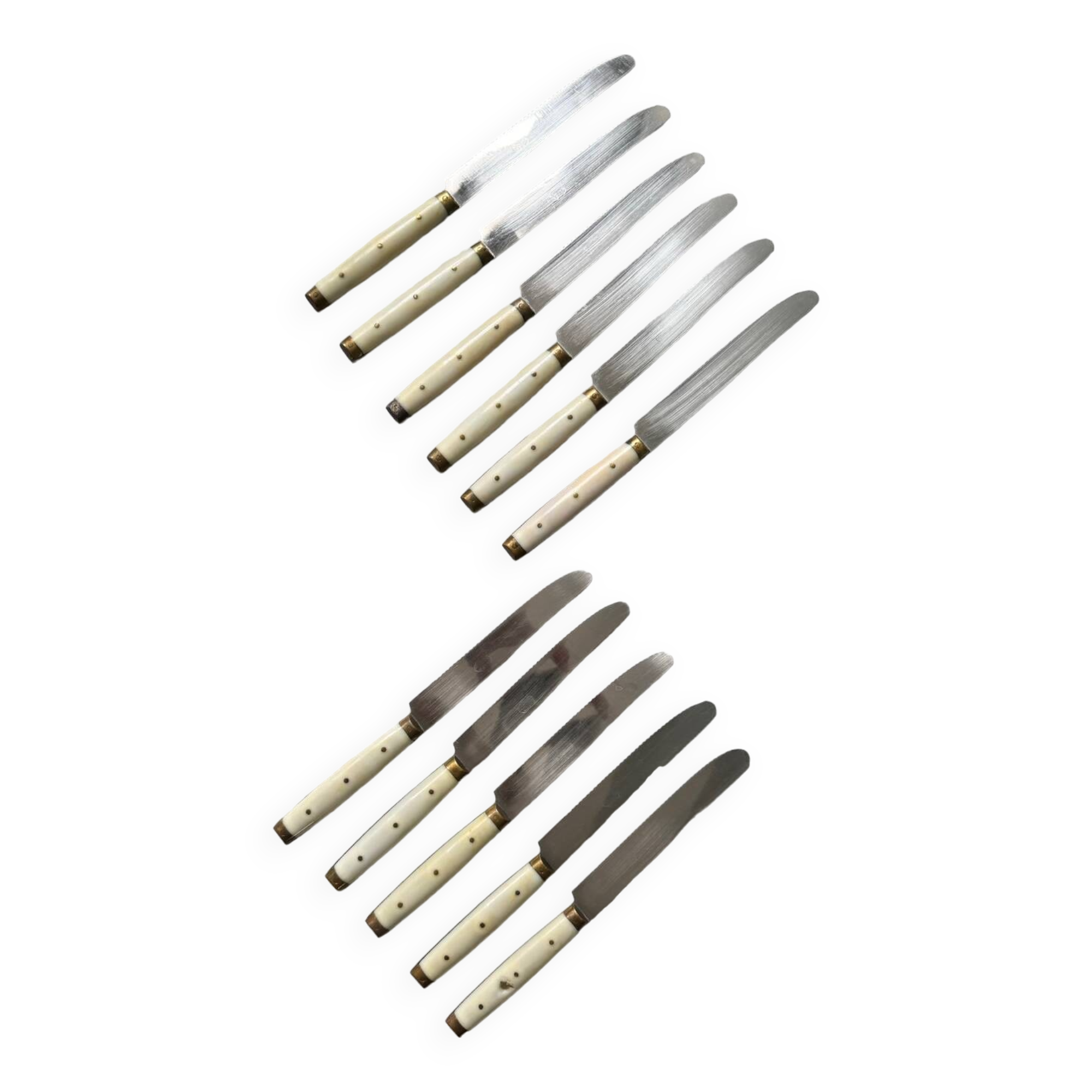 Series of 11 vintage serrated table knives