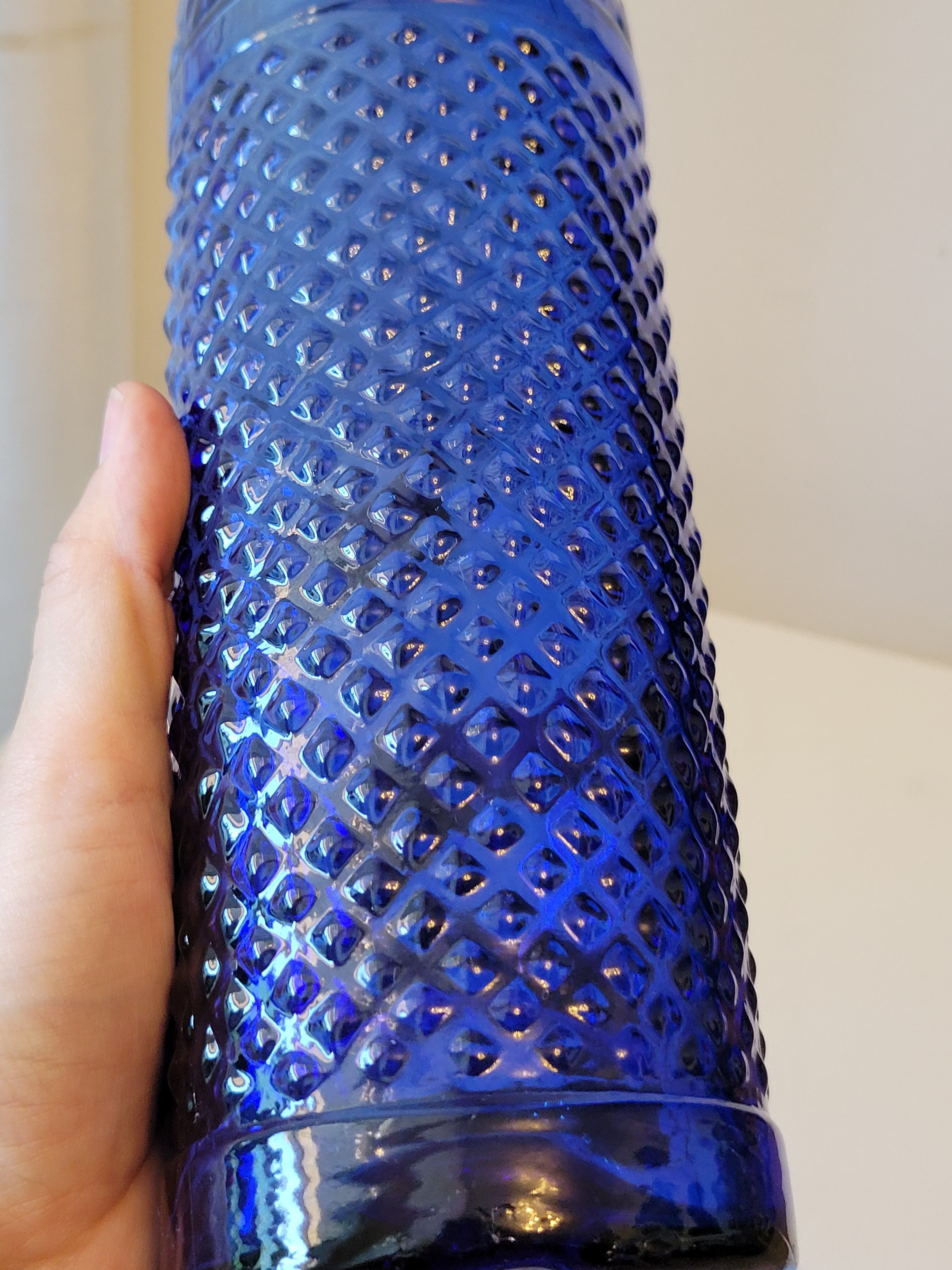 Vintage decanter bottle made of blue molded pressed glass