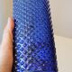 Vintage decanter bottle made of blue molded pressed glass