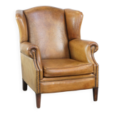 Sheep leather wingback chair with patina