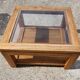 Glass coffee table in wood