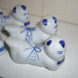 Wears vintage porcelain knives