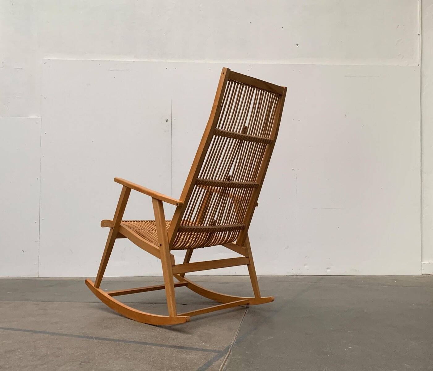 Mid-century German rattan rocking chair from Deutschen Werkstätten Hellerau, 1960s.