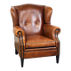Sheepskin leather wingback armchair, with nails and black piping