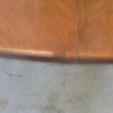 Mahogany round table with 4 extensions from the 1950s