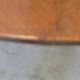 Mahogany round table with 4 extensions from the 1950s