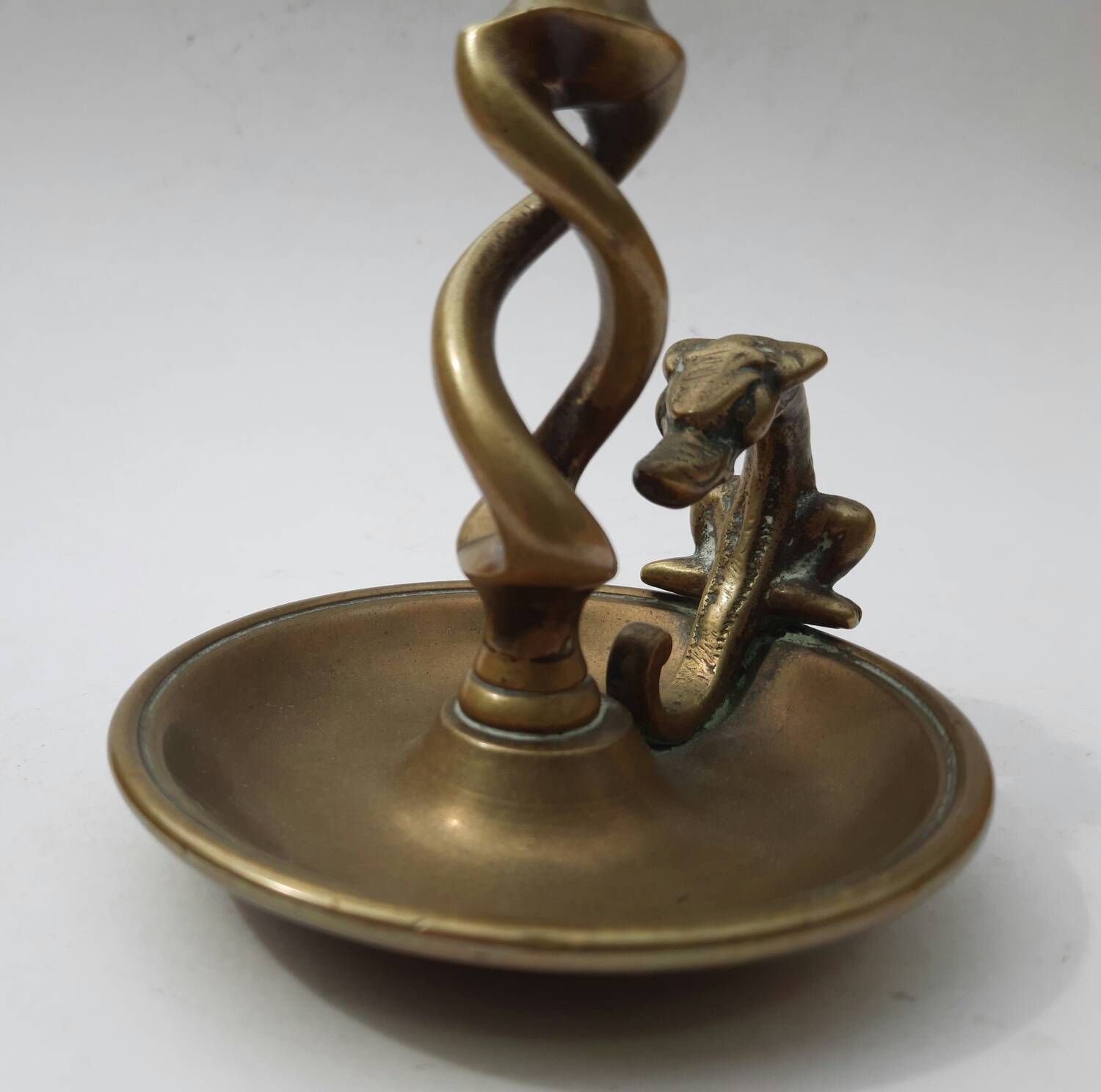 Antique bronze candlestick with dragon-shaped handle from the 17th century