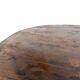 Brutalist coffee table in solid teak, monolithic slab, tripod base.