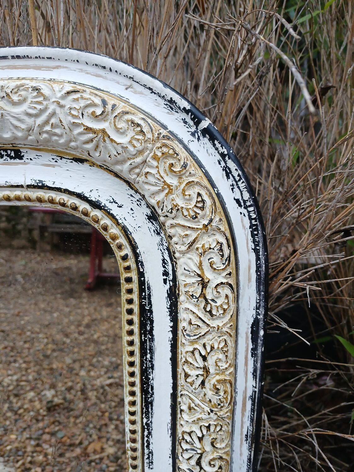 Antique mirror with carved wooden frame