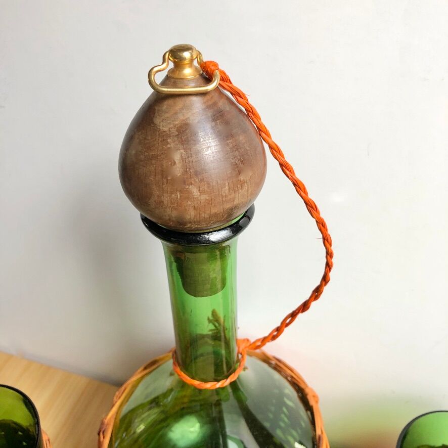 Service carafe and vintage glasses, with wicker