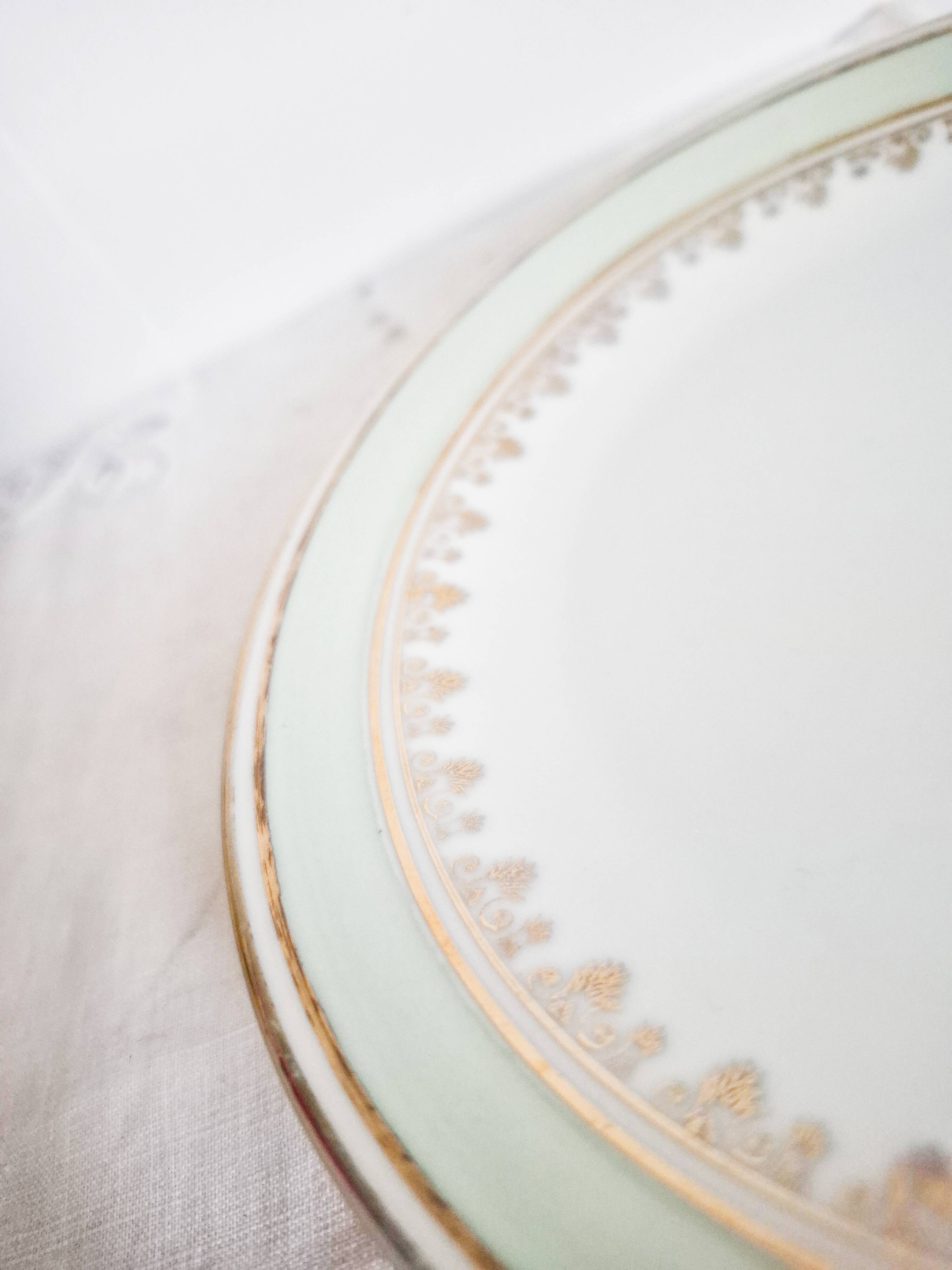 French porcelain dessert plates, green and gold.