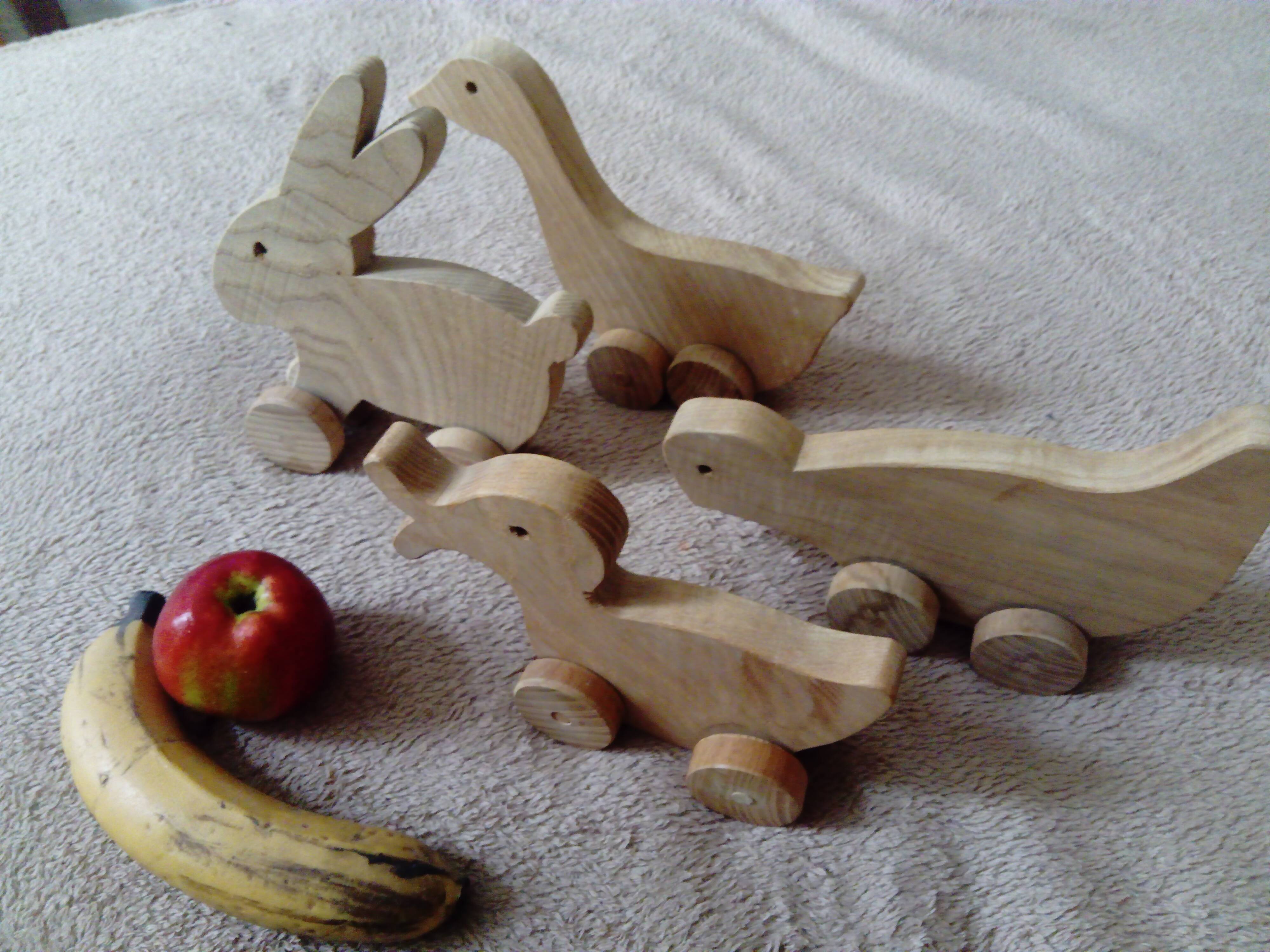 set of 4 wooden toys on wheels