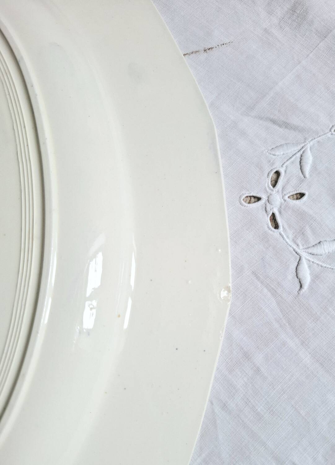 Mismatched antique flat plates accompanied by dishes.