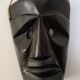 Ethnic ebony wood mask for display or hanging.