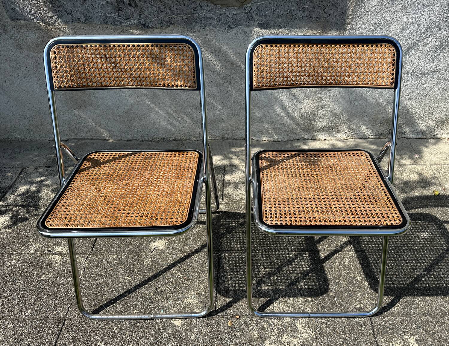 Pair of vintage metal caned folding chairs
