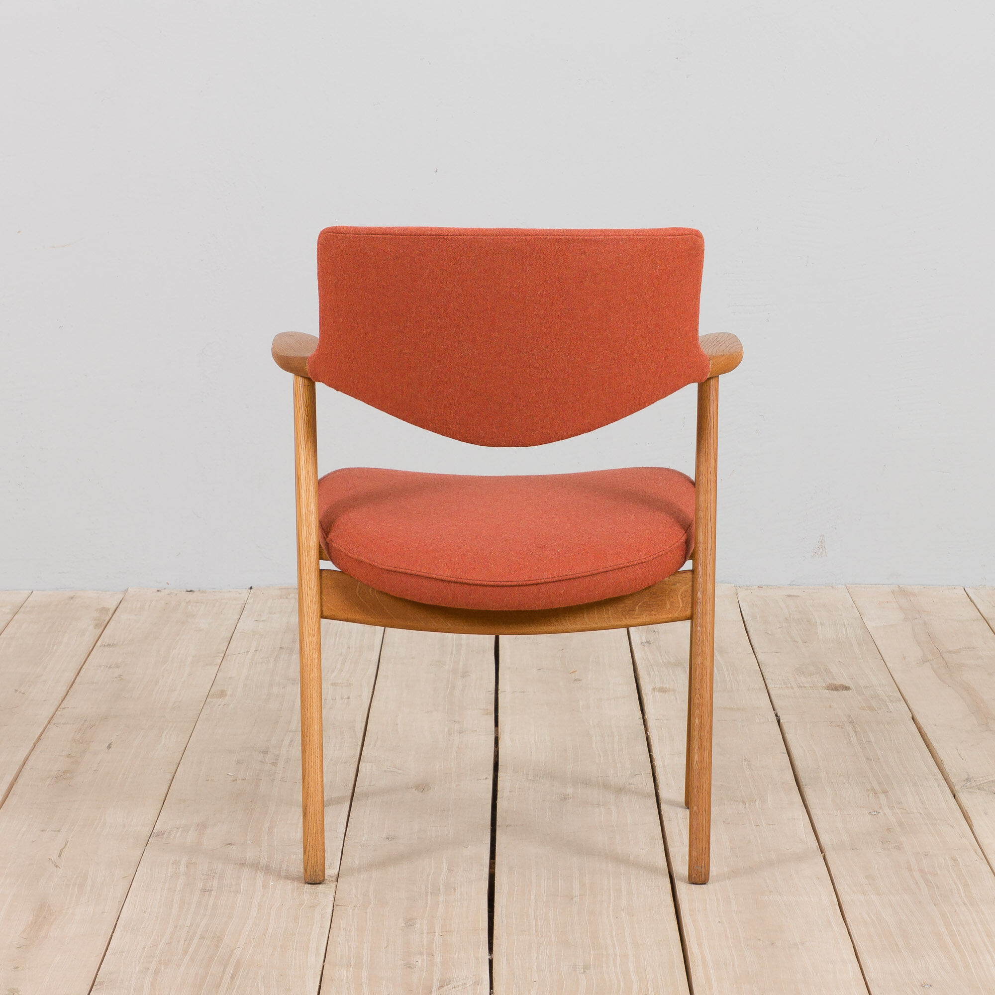 Erik Kirkegaard Oak desk chair in new pale red  wool upholstery.